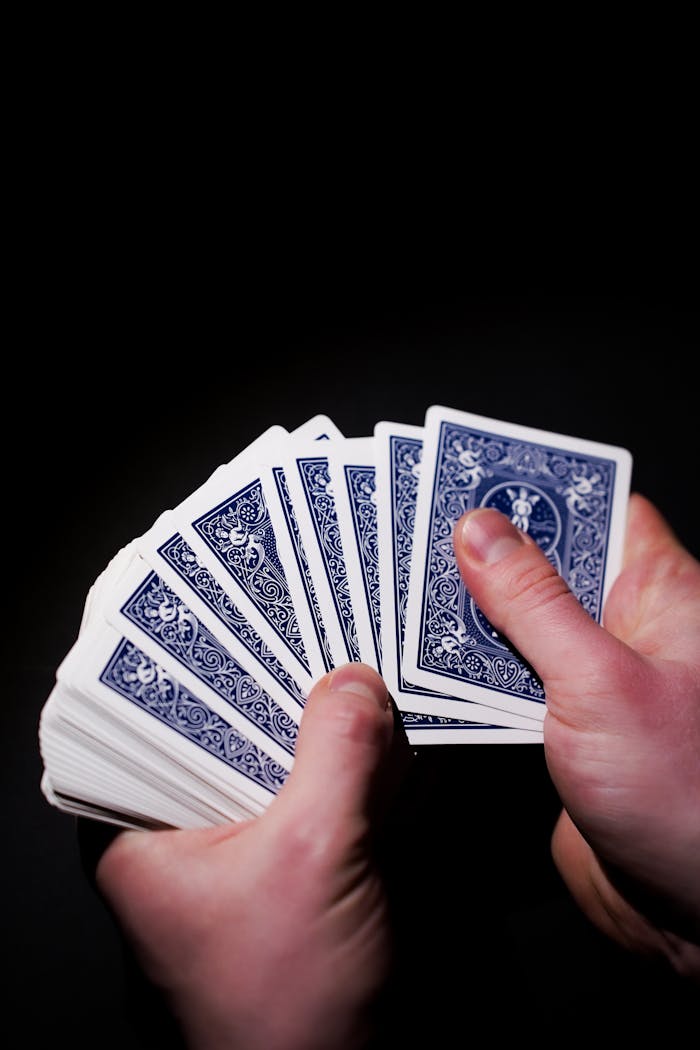 A person holding a deck of playing cards