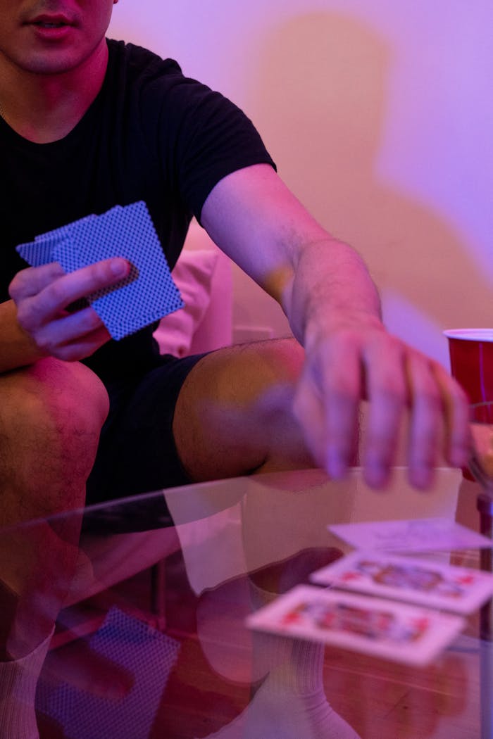 Close-Up Shot of a Person Holding Cards